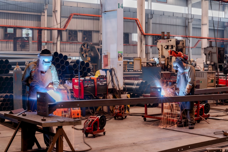 Welders working in a workshop
